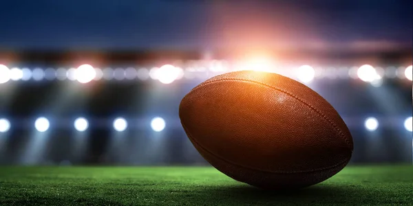 Night football arena in lights with a ball close up — Stock Photo, Image