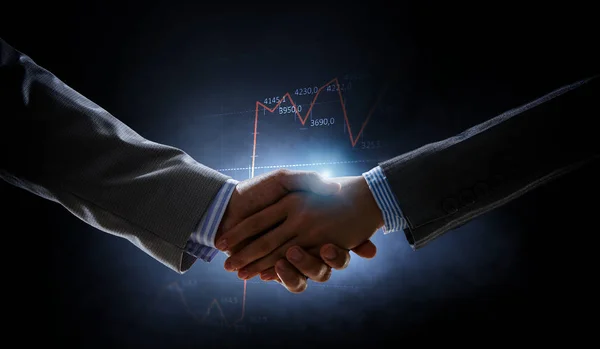 Business handshake by a man and a woman. — Stock Photo, Image