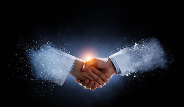 Business handshake by a man and a woman. — Stock Photo, Image