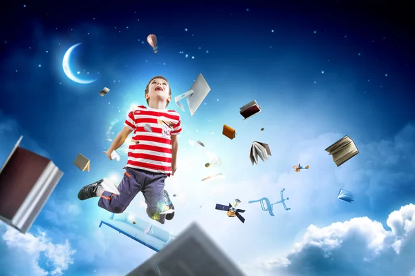 Söt glad liten pojke hoppar. Blandade medier — Stockfoto