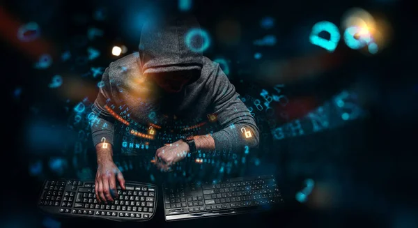 Hacker en sudadera con capucha tema oscuro —  Fotos de Stock