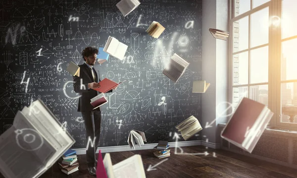 Young man reading a book. Mixed media — Stock Photo, Image