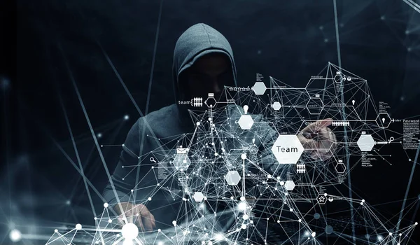 Hacker in hoodie donker thema — Stockfoto