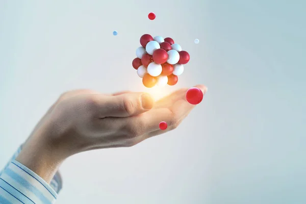 Businessman hands holding a bunch of spheres levitating above. Mixed media — Stock Photo, Image