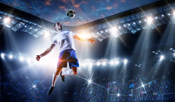 Soccer player on stadium in action. Mixed media — Stock Photo, Image