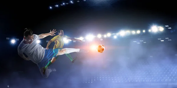 Soccer players on stadium in action. Mixed media — Stock Photo, Image