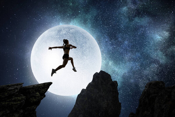 Jumping over precipice, challenge concept.