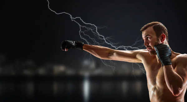 Punch of professional young boxer — Stock Photo, Image