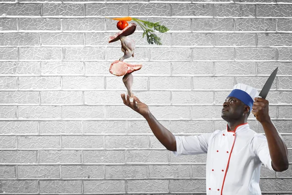Black chef creative cooking. Mixed media. — Stock Photo, Image