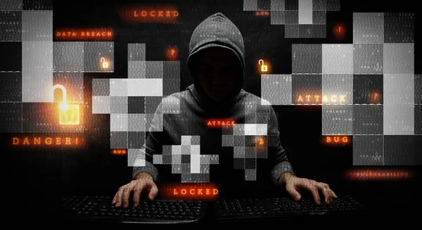 Hacker in felpa con cappuccio tema scuro — Foto Stock