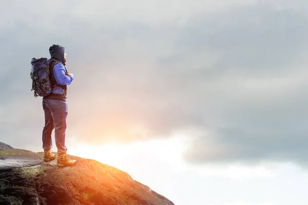 Hiker man in mountains. Mixed media — Stock Photo, Image