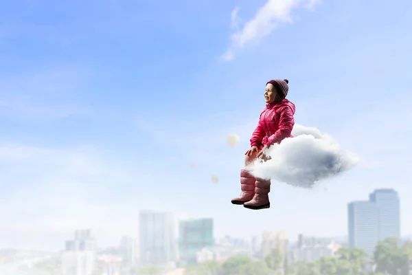 Child float on cloud . Mixed media — Stock Photo, Image