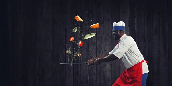 Black chef creative cooking. Mixed media. — Stock Photo, Image