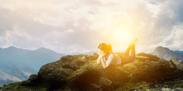 Young woman in casual clothes lying relaxed — Stock Photo, Image