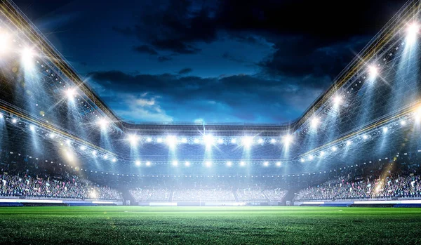 Arena de futebol noite inteira em luzes — Fotografia de Stock