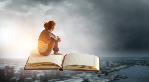 Little woman with large book concept