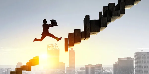 Businessman jump over leap. Mixed media — Stock Photo, Image