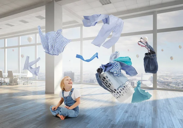 Happy little girl with washed clothes — Stock Photo, Image