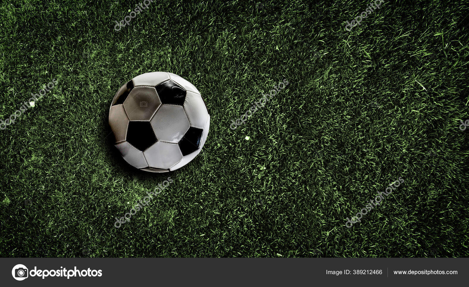 Soccer ball on grass background Stock Photo by ©SergeyNivens 389212466