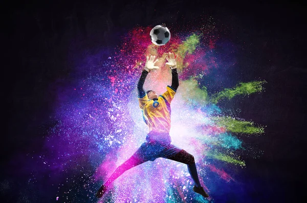 Boy playing soccer hitting the ball — Stock Photo, Image