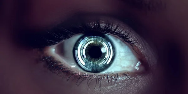 Close up of woman eye in process of scanning — Stock Photo, Image