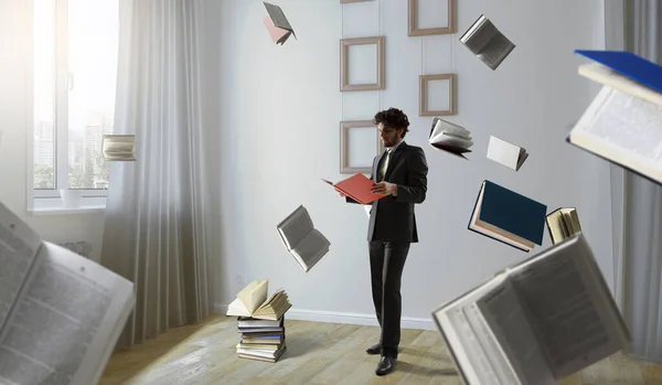 Zimmer voller fliegender Bücher — Stockfoto
