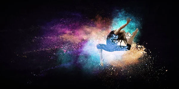 Female dancer against colourful background — Stock Photo, Image