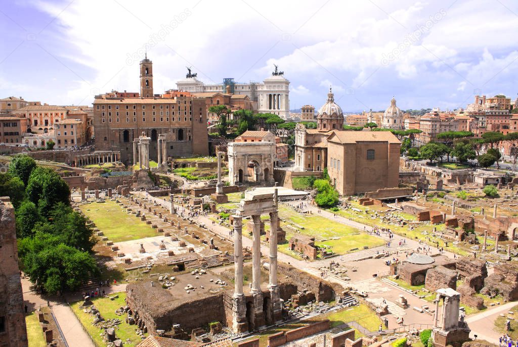 Aerial view on Roman forum - the center in ancient Rome. Temple of Vespasian and Titus, temple of Saturn and triumphal arch of Septimius Severus. Rome, Italy, Europe