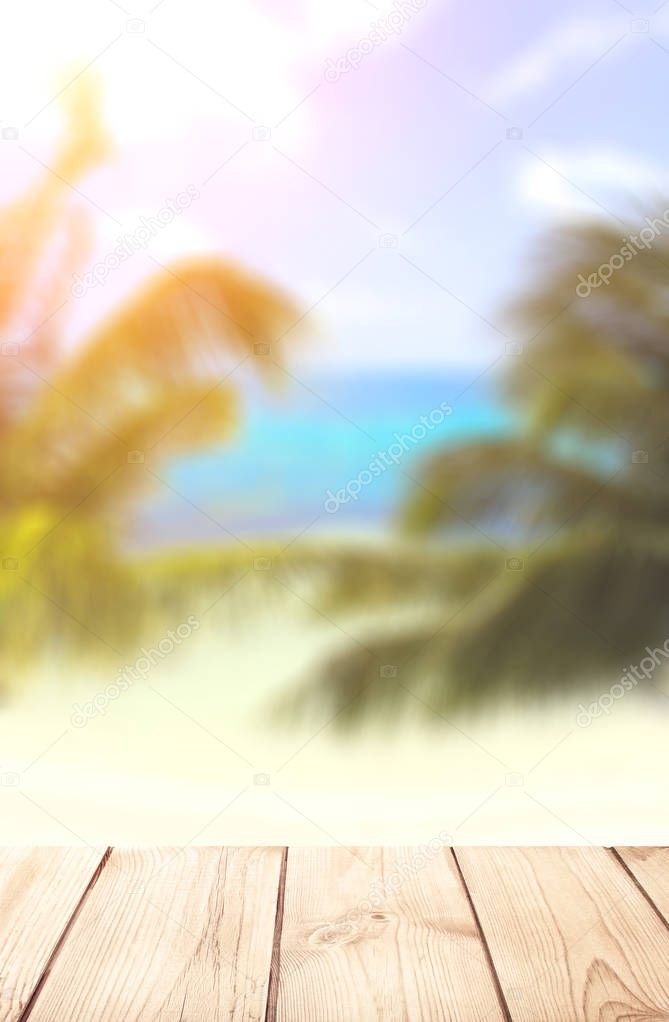 Wooden table top on blurred seascape background