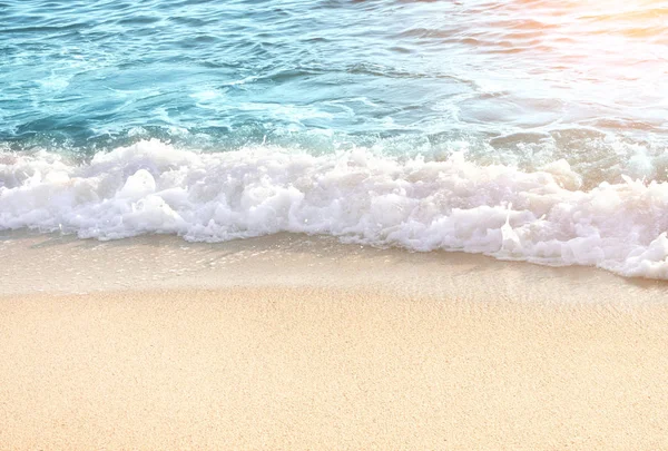 Soft blue ocean wave on sandy beach — Stock Photo, Image