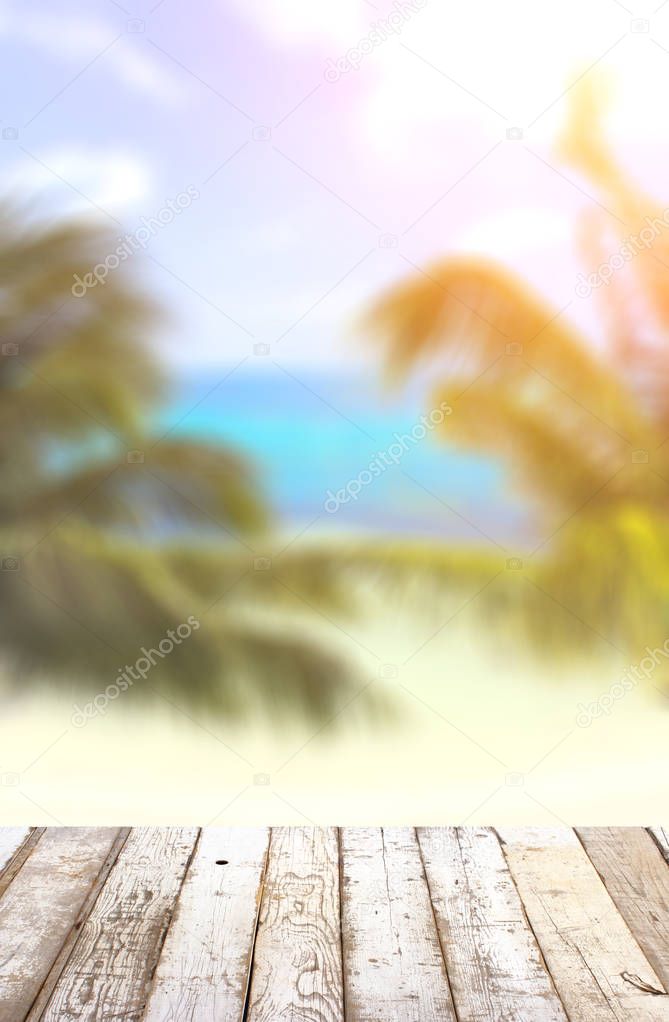 Wooden table top on blurred seascape background