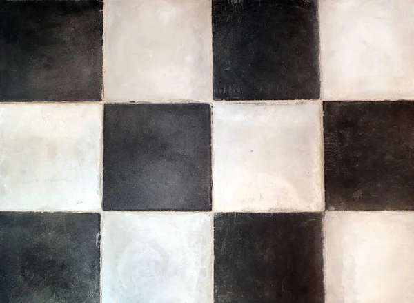 Old porcelain checkered tiles floor texture with tiles of white and black colors