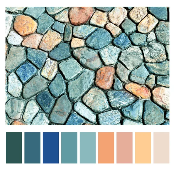 Color matching palette with complimentary colour swatches. Texture of ancient paving stone of blue, gray, red and yellow colors