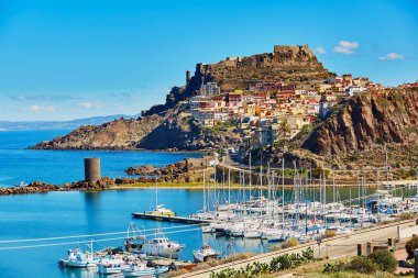 Scenic view to Castelsardo village with its castle and marina in Sardinia, Italy clipart