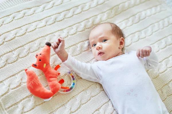 Newborn Baby Girl Lying Knitted Blanket Smiling Looking Colorful Wooden — Stock Photo, Image