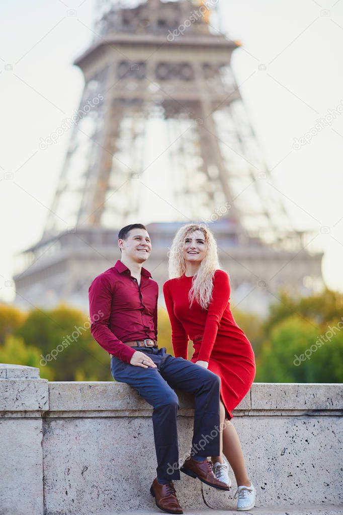 Romantic couple in love near the Eiffel tower in Paris, France