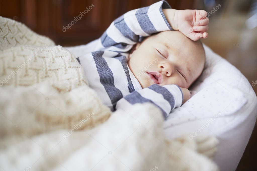 Adorable baby girl sleeping in the crib