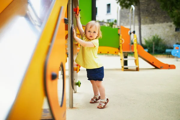 Adorable toddler girl near playground slide — Stock Photo, Image