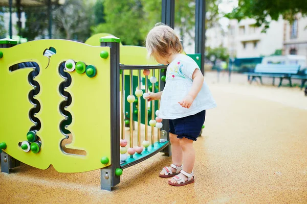 Adorable toddler girl having fun on playground — Stock Photo, Image