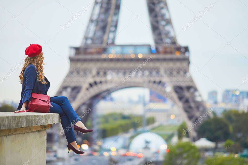 Young woman with long blond curly hair in Paris, France