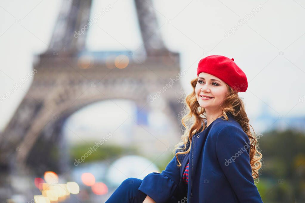 Young woman with long blond curly hair in Paris, France