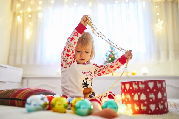 Happy Little Toddler Girl Wearing Pajamas Playing Christmas Decorations Bed — Stock Photo, Image