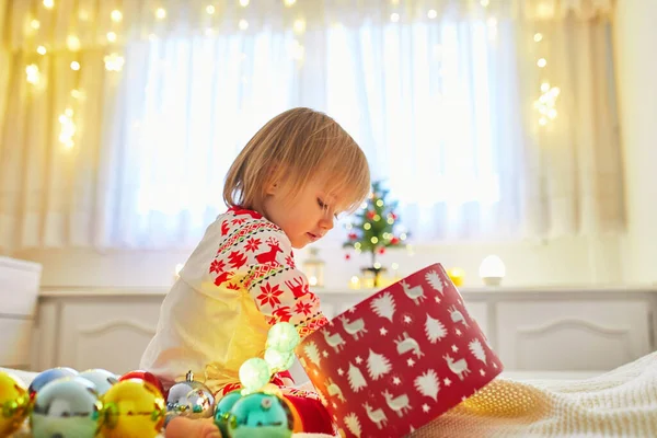 Happy Little Toddler Girl Wearing Pajamas Playing Christmas Decorations Bed — Stock Photo, Image