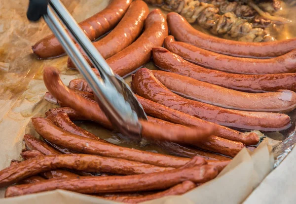 Fried sausages on the street. — Stock Photo, Image