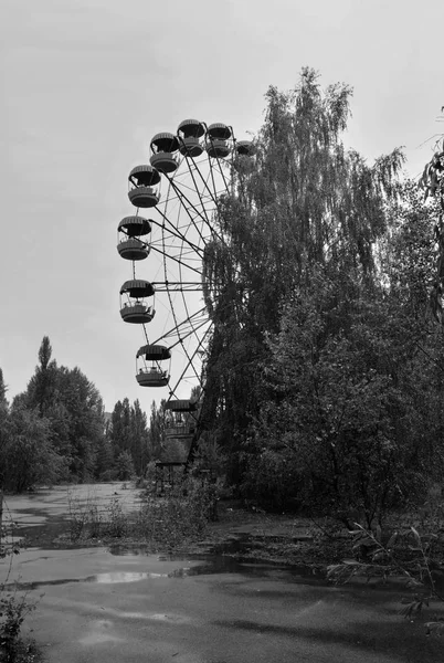 Ferris wheel in abandoned ghost city Pripyat,nothern Ukraine.It  is an empty city near the border with Belarus.Pripyat was founded on in 1970, the ninth nuclear city in Soviet Union, for the Chernobyl Nuclear Power Plant.