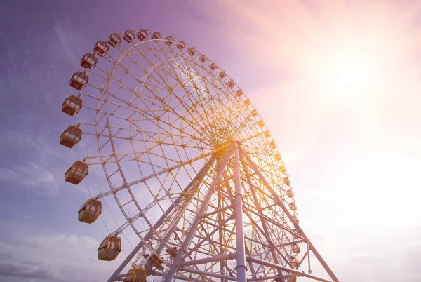 Ferris Wheel Over Blue Sky. Ferris wheel joy sky clouds. Park