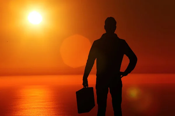 male silhouette at sunset suitcase looking into the distance