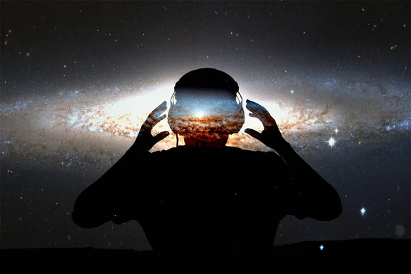 Silhouette young man with headphone on stars background. This image elements furnished by NASA.
