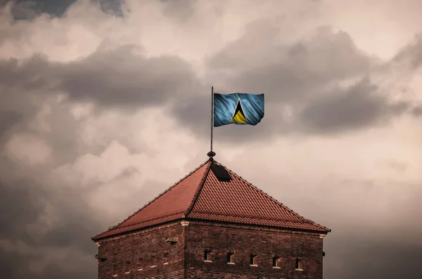 Beautiful flailing flag on the roof of the old fortress — Stock Photo, Image