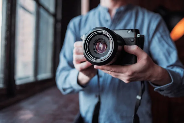 Camera in hand. Close-up of hand holding camera — Stock Photo, Image